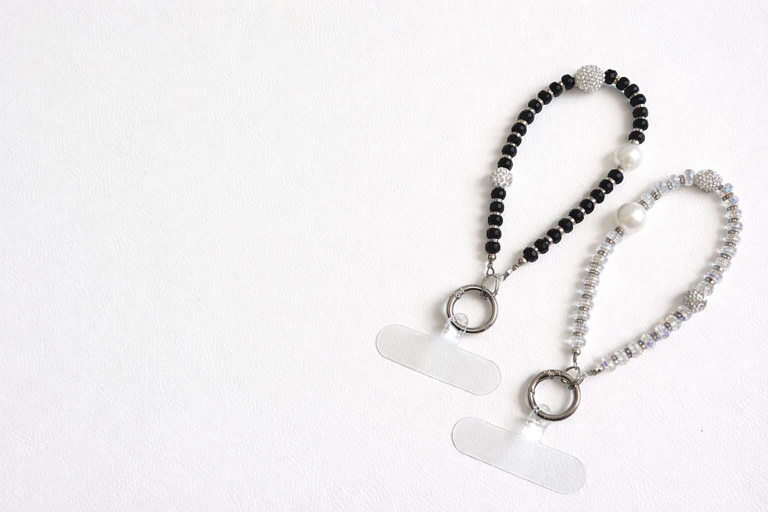 Two beaded necklaces with toggle clasps on a white background.
